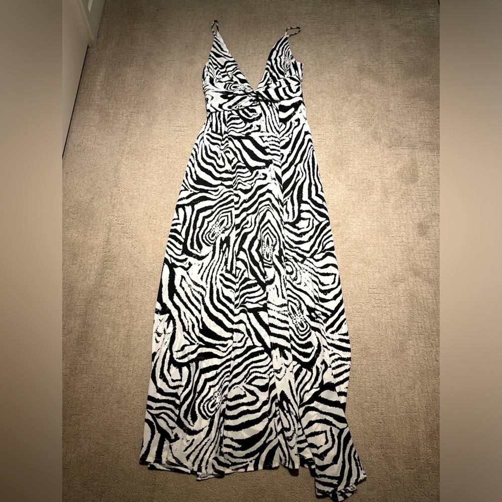 Akira maxi length dress black and white v-neck front and back. Open split sides.